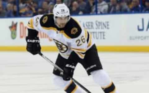 Mar 8, 2016; Tampa, FL, USA; Boston Bruins defenseman John-Michael Liles (26) skates with the puck against the Tampa Bay Lightning during the first period at Amalie Arena. Mandatory Credit: Kim Klement-USA TODAY Sports