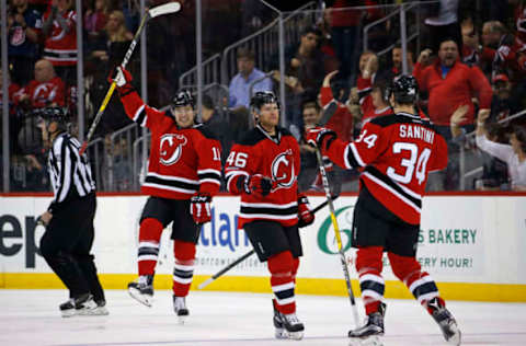 NHL Power Rankings: New Jersey Devils defenseman Steven Santini (34) celebrates with teammates after scoring a goal during the first period against the Montreal Canadiens at Prudential Center. Mandatory Credit: Adam Hunger-USA TODAY Sports