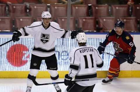 Nov 23, 2015; Sunrise, FL, USA; Los Angeles Kings right wing Marian Gaborik (12) celebrates his goal with center Anze Kopitar (11) as Florida Panthers defenseman Brian Campbell (51) looks on in the third period at BB&T Center. The Kings won 3-1. Mandatory Credit: Robert Mayer-USA TODAY Sports