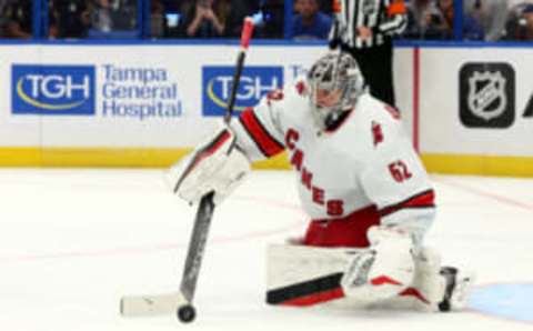 Oct 24, 2023; Tampa, Florida, USA; Carolina Hurricanes goaltender Pyotr Kochetkov (52) makes a save against the Tampa Bay Lightning during the third period at Amalie Arena. Mandatory Credit: Kim Klement Neitzel-USA TODAY Sports