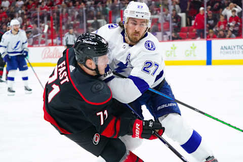 Jun 8, 2021; Raleigh, North Carolina, USA; Tampa Bay Lightning defenseman Ryan McDonagh (27) checks Carolina Hurricanes right wing Jesper Fast (71) in game five of the second round of the 2021 Stanley Cup Playoffs at PNC Arena. Mandatory Credit: James Guillory-USA TODAY Sports