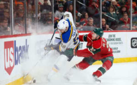 Mar 7, 2017; Saint Paul, MN, USA; St Louis Blues forward Magnus Paajarvi (56) and Minnesota Wild defenseman Gustav Olofsson (23) skate after the puck and in the first period at Xcel Energy Center. Mandatory Credit: Brad Rempel-USA TODAY Sports