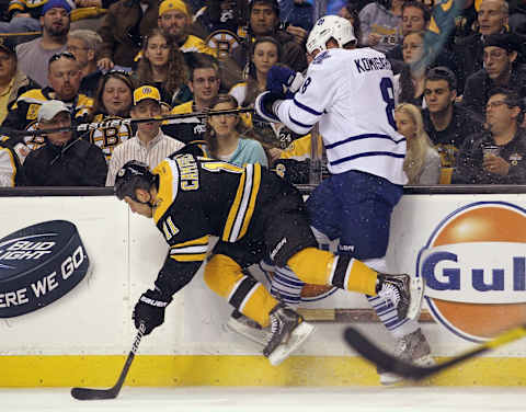 BOSTON, MA – MARCH 19: Gregory Campbell #11 of the Boston Bruins and Mike Komisarek #8 of the Toronto Maple Leafs. (Photo by Bruce Bennett/Getty Images)