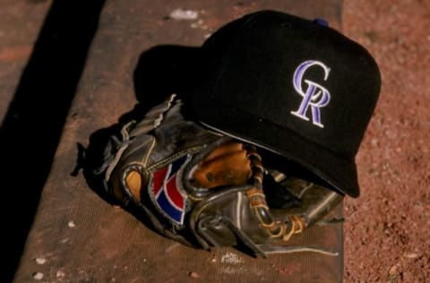 27 Feb 1998: A general view of a glove and a Colorado Rockies cap during a spring training game between the Colorado Rockies and the San Francisco Giants at the Hi Corbett Field in Tucson, Arizona. Mandatory Credit: Brian Bahr /Allsport