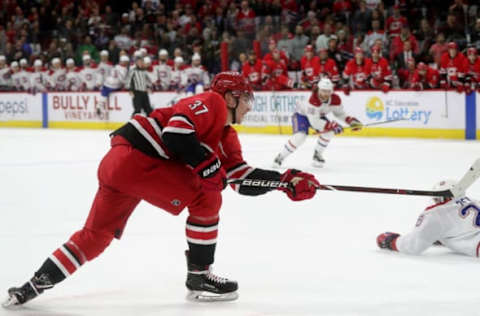 RALEIGH, NC – MARCH 24: Andrei Svechnikov #37 of the Carolina Hurricanes shoots the puck and scores the game winner in overtime to defeat the Montreal Canadiens during an NHL game on March 24, 2019 at PNC Arena in Raleigh, North Carolina. (Photo by Gregg Forwerck/NHLI via Getty Images)