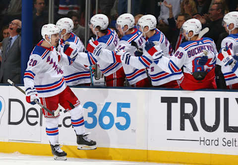 UNIONDALE, NEW YORK – JANUARY 16: Chris Kreider #20 of the New York Rangers high-fives teammates after scoring the game-winning goal during the third period against the New York Islanders at NYCB Live’s Nassau Coliseum on January 16, 2020 in Uniondale, New York. (Photo by Mike Stobe/NHLI via Getty Images)