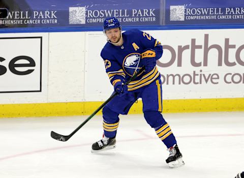 Apr 18, 2021; Buffalo, New York, USA; Buffalo Sabres center Sam Reinhart (23) makes a pass against the Pittsburgh Penguins during the third period at KeyBank Center. Mandatory Credit: Timothy T. Ludwig-USA TODAY Sports