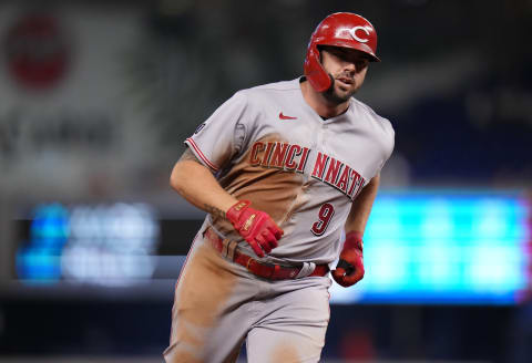 MIAMI, FLORIDA – AUGUST 27: Mike Moustakas #9 of the Cincinnati Reds runs the bases after hitting a solo homerun in the eighth inning against the Miami Marlins at loanDepot park on August 27, 2021 in Miami, Florida. (Photo by Mark Brown/Getty Images)