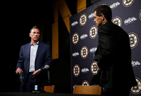 BOSTON – JUNE 17: Boston Bruins general manager Don Sweeney, right, and coach Bruce Cassidy stand up to leave following the end of the year press conference at TD Garden in Boston on June 17, 2019. (Photo by Jessica Rinaldi/The Boston Globe via Getty Images)