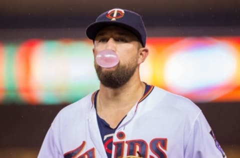 Sep 6, 2016; Minneapolis, MN, USA; Minnesota Twins first baseman Trevor Plouffe (24) blows a bubble as he walks back to the dugout in the fifth inning against the Kansas City Royals at Target Field. The Kansas City Royals beat the Minnesota Twins 10-3. MLB. Mandatory Credit: Brad Rempel-USA TODAY Sports