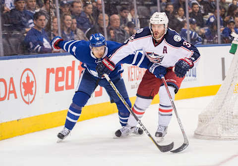 TORONTO, ON – APRIL 09: Toronto Maple Leafs defenseman Connor Carrick (8) battles with Columbus Blue Jackets center Boone Jenner (38) during the third period in a game on April 9, 2017, at Air Canada Centre in Toronto, Ontario Canada.The Columbus Blue Jackets won 3-2. (Photo by Nick Turchiaro/Icon Sportswire via Getty Images)