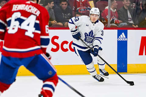 Sep 30, 2023; Montreal, Quebec, CAN; Toronto Maple Leafs center Roni Hirvonen (33) plays the puck against the Montreal Canadien during the third period at Bell Centre. Mandatory Credit: David Kirouac-USA TODAY Sports