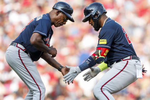 Jun 24, 2023; Cincinnati, Ohio, USA; Atlanta Braves designated hitter Marcell Ozuna (20) celebrates with third base coach Ron Washington (37) after hitting a solo home run in the seventh inning at Great American Ball Park. Mandatory Credit: Katie Stratman-USA TODAY Sports