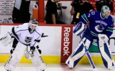 Apr 4, 2016; Vancouver, British Columbia, CAN; Los Angeles Kings goaltender Jhonas Enroth (1) and Vancouver Canucks goaltender Jacob Markstrom (25) warm up at Rogers Arena. The Vancouver Canucks won 3-2. Mandatory Credit: Anne-Marie Sorvin-USA TODAY Sports