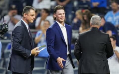 J.J. Picollo (left) with Bobby Witt and Dayton Moore (back to camera). Jay Biggerstaff-USA TODAY Sports