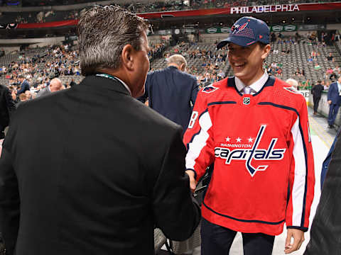 DALLAS, TX – JUNE 23: Mitchell Gibson greets his team after being selected 124th overall by the Washington Capitals during the 2018 NHL Draft at American Airlines Center on June 23, 2018 in Dallas, Texas. (Photo by Brian Babineau/NHLI via Getty Images)