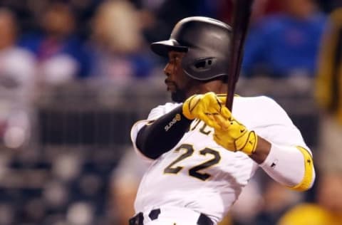 Sep 27, 2016; Pittsburgh, PA, USA; Pittsburgh Pirates center fielder Andrew McCutchen (22) hits a two run single against the Chicago Cubs during the ninth inning at PNC Park. The Cubs won 6-4. Mandatory Credit: Charles LeClaire-USA TODAY Sports