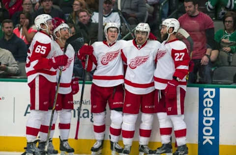 NHL Predictions: Detroit Red Wings defenseman Danny DeKeyser (65) and center Dylan Larkin (71) and center Andreas Athanasiou (72) and defenseman Kyle Quincey (27) and Detroit Red Wings center Luke Glendening (41) celebrate Athanasiou