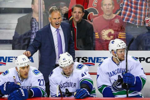 Apr 21, 2015; Calgary, Alberta, CAN; Vancouver Canucks head coach Willie Desjardins on his bench against the Calgary Flames during the third period in game four of the first round of the 2015 Stanley Cup Playoffs at Scotiabank Saddledome. Calgary Flames won 3-1. Mandatory Credit: Sergei Belski-USA TODAY Sports