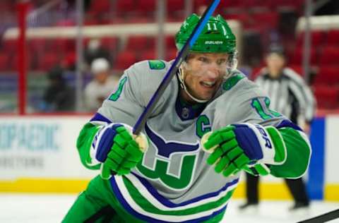 Feb 19, 2021; Raleigh, North Carolina, USA; Carolina Hurricanes center Jordan Staal (11) skates against the Chicago Blackhawks at PNC Arena. Mandatory Credit: James Guillory-USA TODAY Sports