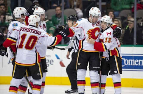 Dec 6, 2016; Dallas, TX, USA; Calgary Flames right wing Kris Versteeg (10) and defenseman TJ Brodie (7) and right wing Troy Brouwer (36) and center Sean Monahan (23) and left wing Johnny Gaudreau (13) celebrate Monahan