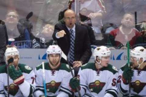 December 12, 2015; San Jose, CA, USA; Minnesota Wild head coach Mike Yeo instructs during the third period against the San Jose Sharks at SAP Center at San Jose. The Wild defeated the Sharks 2-0. Mandatory Credit: Kyle Terada-USA TODAY Sports