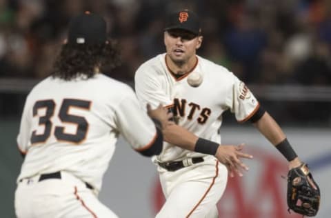 Apr 24, 2017; San Francisco, CA, USA; San Francisco Giants second baseman Joe Panik (12) throws to shortstop Brandon Crawford (35) for an out against the Los Angeles Dodgers in the fifth inning at AT&T Park. Mandatory Credit: John Hefti-USA TODAY Sports