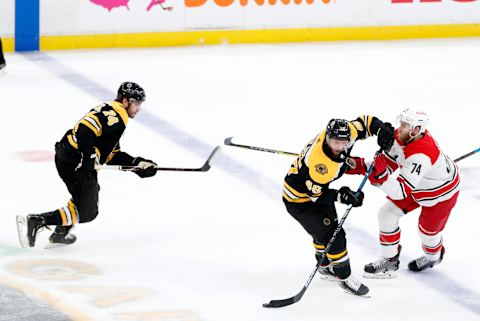 BOSTON, MA – MAY 12: Boston Bruins center David Krejci (46) drops the puck off for Boston Bruins left wing Jake DeBrusk (74) eliciting Carolina Hurricanes defenseman Jaccob Slavin (74) during Game 2 of the Stanley Cup Playoffs Eastern Conference Finals between the Boston Bruins and the Carolina Hurricanes on May 12, 2019, at TD Garden in Boston, Massachusetts. (Photo by Fred Kfoury III/Icon Sportswire via Getty Images)