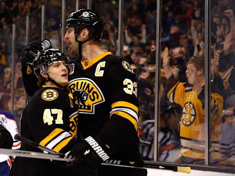 Torey Krug #47 of the Boston Bruins celebrates his goal with Zdeno Chara #33. (Photo by Jim Rogash/Getty Images)