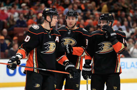 ANAHEIM, CA – APRIL 14: Corey Perry #10, Adam Henrique #14, and Nick Ritchie #37 of the Anaheim Ducks talk during the second period in Game Two of the Western Conference First Round against the San Jose Sharks during the 2018 NHL Stanley Cup Playoffs at Honda Center on April 14, 2018, in Anaheim, California. (Photo by Sean M. Haffey/Getty Images)