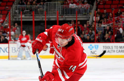 RALEIGH, NC – MARCH 27: Nathan Gerbe #14 of the Carolina Hurricanes looks to snap a wrister during an NHL game against the New Jersey Devils at PNC Arena on March 27, 2016 in Raleigh, North Carolina. (Photo by Gregg Forwerck/NHLI via Getty Images)