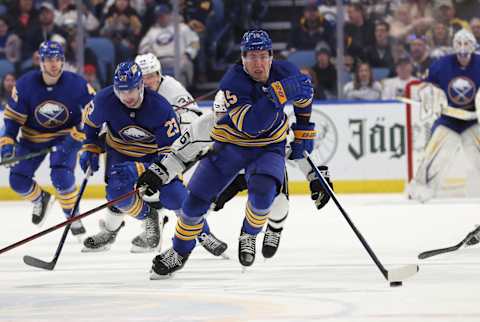 Mar 6, 2022; Buffalo, New York, USA; Buffalo Sabres defenseman Casey Fitzgerald (45) brings the puck up ice during the second period against the Los Angeles Kings at KeyBank Center. Mandatory Credit: Timothy T. Ludwig-USA TODAY Sports