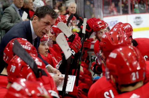 RALEIGH, NC – MARCH 28: Head coach Rod Brind’Amour of the Carolina Hurricanes draws up a play and communicates it during a timeout during an NHL game against the Washington Capitals on March 28, 2019 at PNC Arena in Raleigh, North Carolina. (Photo by Gregg Forwerck/NHLI via Getty Images)