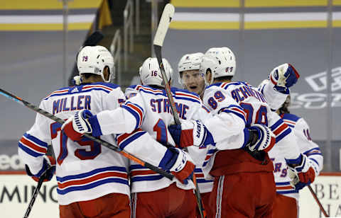 Jan 24, 2021; Pittsburgh, Pennsylvania, USA; The New York Rangers celebrate as defenseman Jacob Trouba (8) reacts to a goal by center Ryan Strome (16) against the Pittsburgh Penguins during the second period at the PPG Paints Arena. Mandatory Credit: Charles LeClaire-USA TODAY Sports