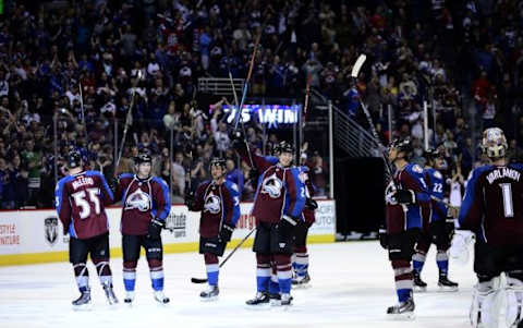 Apr 11, 2015; Denver, CO, USA; Members of the Colorado Avalanche celebrate the win over the Chicago Blackhawks at the Pepsi Center. The Avalanche defeated the Blackhawks 3-2. Mandatory Credit: Ron Chenoy-USA TODAY Sports