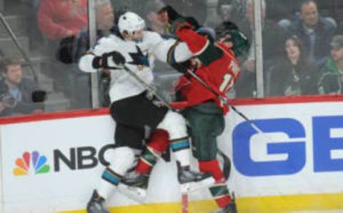 San Jose Sharks defenseman Brenden Dillon (4) checks Minnesota Wild forward Zach Parise (11) (Marilyn Indahl-USA TODAY Sports)