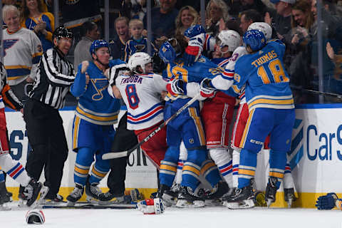 St. Louis Blues and the New York Rangers tussle after the game at Enterprise Center