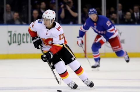 Johnny Gaudreau #13 of the Calgary Flames skates with the puck in the third period against the New York Rangers (Photo by Abbie Parr/Getty Images)