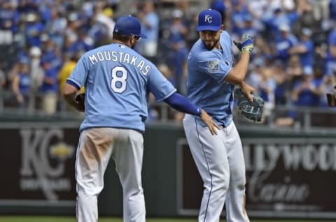 Apr 24, 2016; Kansas City, MO, USA; Kansas City Royals players Mike Moustakas (left) and Eric Hosmer (right) celebrate after beating the Baltimore Orioles at Kauffman Stadium. Kansas City won 6-1. Mandatory Credit: Peter G. Aiken-USA TODAY Sports