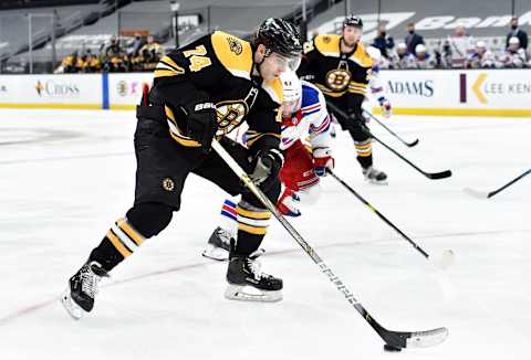 Mar 11, 2021; Boston, Massachusetts, USA; Boston Bruins left wing Jake DeBrusk (74) controls the puck during the third period against the New York Rangers at TD Garden. Mandatory Credit: Bob DeChiara-USA TODAY Sports