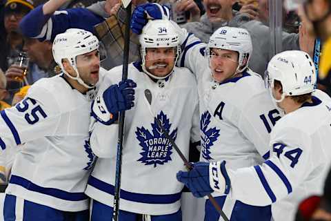 Mar 29, 2022; Boston, Massachusetts, USA; Toronto Maple Leafs right wing Mitchell Marner (16) is congratulated after  . Mandatory Credit: Winslow Townson-USA TODAY Sports