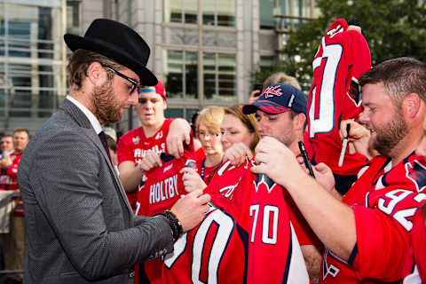 WASHINGTON, DC – OCTOBER 07: Braden Holtby #70 of the Washington Capitals signs autographs for fans on the Rock the Red Carpet prior to the start of a game against the Montreal Canadiens at Capital One Arena on October 7, 2017 in Washington, DC. (Photo by Patrick McDermott/NHLI via Getty Images)