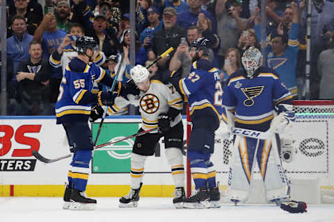 ST LOUIS, MISSOURI – JUNE 03: Charlie McAvoy #73 of the Boston Bruins gets tangled up with Alex Pietrangelo #27 and Colton Parayko #55 of the St. Louis Blues in Game Four of the 2019 NHL Stanley Cup Final at Enterprise Center on June 03, 2019 in St Louis, Missouri. (Photo by Bruce Bennett/Getty Images)