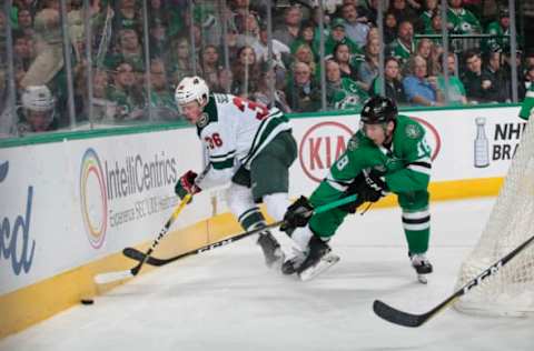 DALLAS, TX – MARCH 31: Nick Seeler #36 of the Minnesota Wild tries to keep the puck away against Tyler Pitlick #18 of the Dallas Stars at the American Airlines Center on March 31, 2018 in Dallas, Texas. (Photo by Glenn James/NHLI via Getty Images)