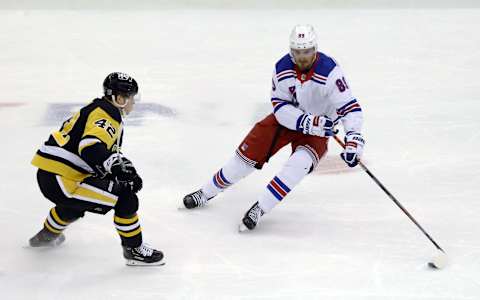 New York Rangers right wing Pavel Buchnevich (89) handles the puck against Pittsburgh Penguins right wing Kasperi Kapanen Credit: Charles LeClaire-USA TODAY Sports