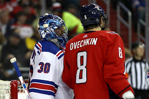 WASHINGTON, DC – MARCH 28: Henrik Lundqvist #30 of the New York Rangers and Alex Ovechkin #8 of the Washington Capitals talk on the ice in the second period at Capital One Arena on March 28, 2018 in Washington, DC. (Photo by Rob Carr/Getty Images)