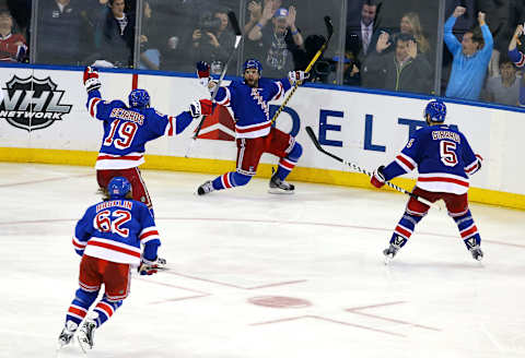 Martin St. Louis #26 of the New York Rangers celebrates after scoring the game winning shot in overtime (Photo by Al Bello/Getty Images)