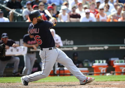 Jul 24, 2016; Baltimore, MD, USA; Cleveland Indians first baseman Mike Napoli (26) hits an RBI single against Baltimore Orioles during the eighth inning at Oriole Park at Camden Yards. The Orioles won 5-3. Mandatory Credit: Brad Mills-USA TODAY Sports