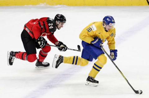 BUFFALO, NY – JANUARY 05: Isac Lundeström #20 of Sweden skates away from Alex Formenton #24 of Canada during the IIHF World Junior Championships Gold Medal game. (Photo by Nicholas T. LoVerde/Getty Images)