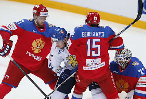 MOSCOW, RUSSIA. APRIL 30, 2016. Russia’s Anton Belov (L), Alexei Bereglazov (15), and goaltender Sergei Bobrovsky (R) defend against Finland’s Leonid Komarov in their 2015/2016 Euro Hockey Tour Group Stage Round 6 ice hockey match at VTB Ice Arena (Ledovy Dvorets). Finland won 3-2. Mikhail Japaridze/TASS (Photo by Mikhail Japaridze\TASS via Getty Images)